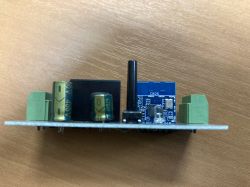 Close-up of the circuit board of a Sonoff WHD06 smart switch.
