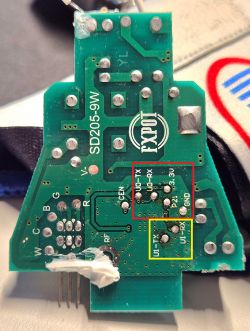Close-up of the SD205-9W circuit board with marked areas for flashing and debug output.