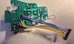 Image of a printed circuit board labeled SD205-9W with attached colored wires.