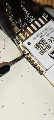 Solder Connections on PCB with Electronic Module Close-up of solder connections on a PCB with an electronic module visible.