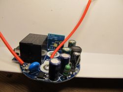 Circuit Board with Components Circuit board with electronic components and red wires.