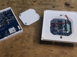 Interior of KHY609 Room Thermostat Disassembled room thermostat with visible electronic components on a table.