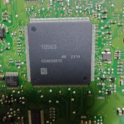 Close-up of a green circuit board with a large integrated circuit marked 10563 and CDAK0061C.
