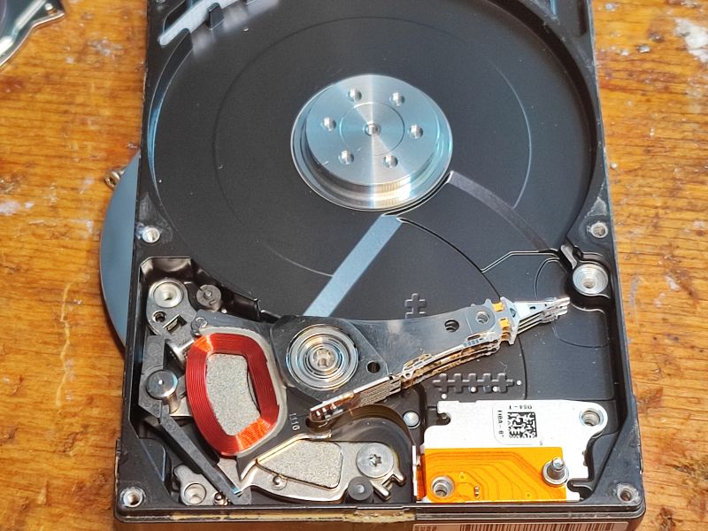 Inside of a Seagate 750 GB Hard Drive Inside of a hard drive showing the platter and head arm