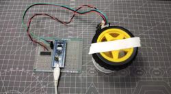 PID Controller Prototype for Motor Control Prototype motor control circuit with a yellow tire