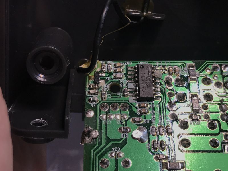 Close-up of a PCB with an IC labeled “C9636” and surrounding SMD components inside a housing