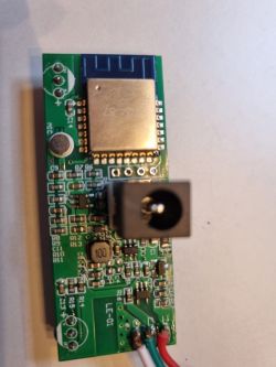 Electronic circuit board with a communication module and power socket.