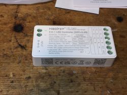 MiBoxer 3 in 1 LED controller on a wooden table.