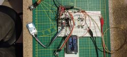 Breadboard with electronic components, a display screen, and wires.