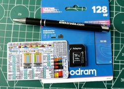 128 GB Goodram microSD card with adapter, pen and pinout reference card