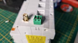 Tuya Three-Phase Energy Meter with A and B Sockets Close-up of a Tuya three-phase energy meter with sockets labeled A and B and an antenna connector on a mounting rail.