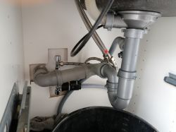 Dishwasher Pumps Water to Sink: Dealing with Clogged Sink and Riser Pipe in a Single-Family House