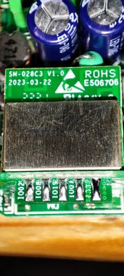SM-028C3 electronic module with ESP32-C3 chip on a carrier board with visible connectors.