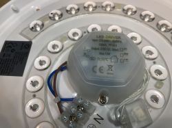 Interior of Woox ceiling lamp with controller and power supply.
