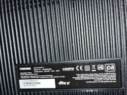 Information label on back panel of Toshiba LCD TV model 65QG5E63DBL