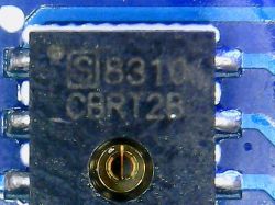 Close-up of a chip labeled CHT8310 CBR128 on a blue PCB.