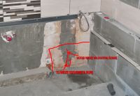 It's dripping down the pipe in the wall behind the bathtub from the bathtub 