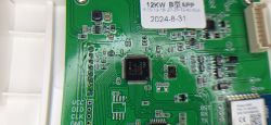Close-up of EV Charger PCB Close-up of a PCB from an EV charger showing a microchip and label 12KW B APP.