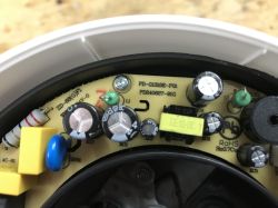 Close-up of the SMART06B kettle PCB with visible capacitors and EE10-06 coil