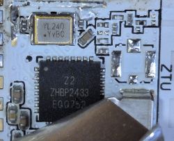 Close-up of a printed circuit board with an integrated circuit and other electronic components.