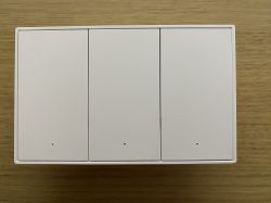 Triple light switch Zemismart KES-606US-W3 on a wooden surface.