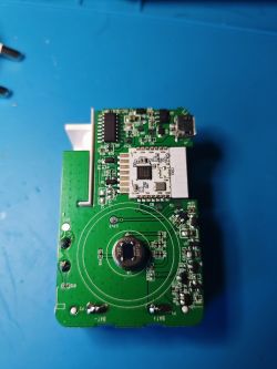 Close-up of a circuit board with electronic components on a blue background.