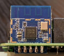 Close-up of an electronic module with visible traces and components on a circuit board.