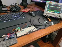 Workstation with Arduino and Oscilloscope Electronics workstation with a computer, oscilloscope, and Arduino on a breadboard.