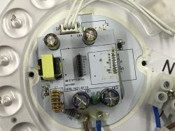 Circuit board with electronic components and markings.