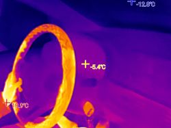 Thermal image of a steering wheel showing temperature range from -12.8°C to 19.9°C