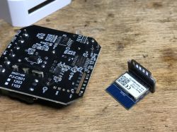Circuit board of a power meter with CB2S module next to it
