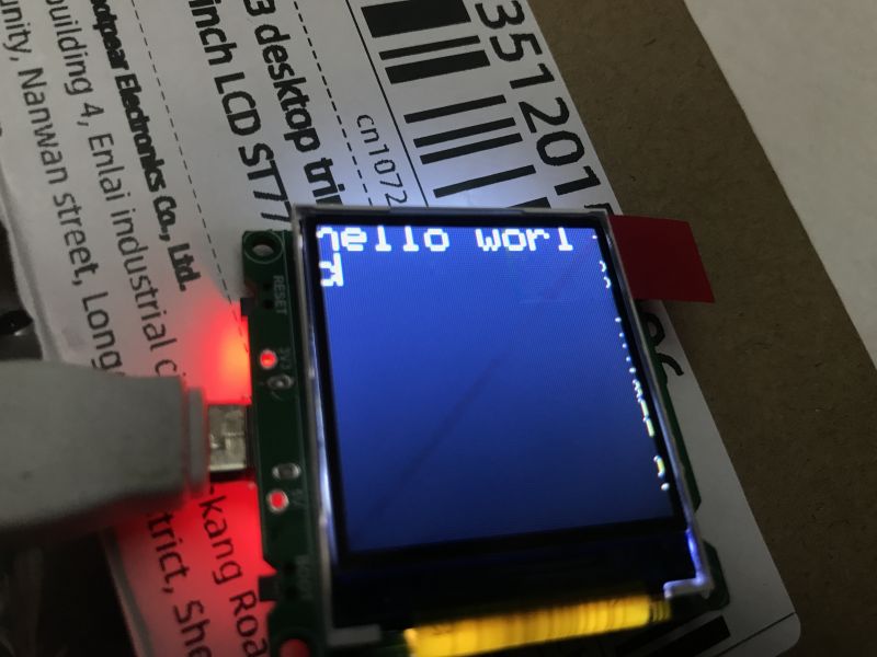 ESP32-C3 LCD Display with hello world Text Small LCD display connected to an ESP32-C3 module showing hello world text.