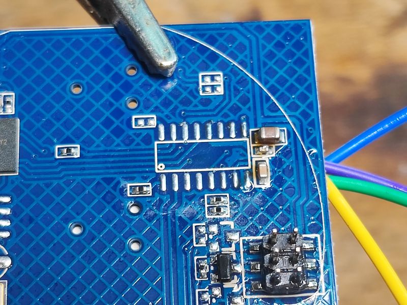 Close-up of PCB with wires PCB with electronic components and colored wires