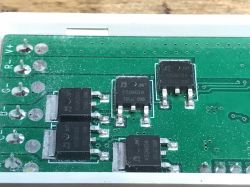 MOSFET Transistors on Miboxer FUT037W+ Board Close-up of MOSFET transistors on a printed circuit board.