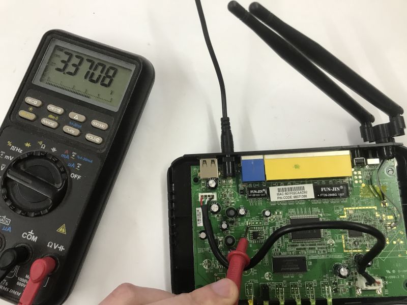 Analysis of the inside of the router, memory ripping, bootloader, custom program for UART