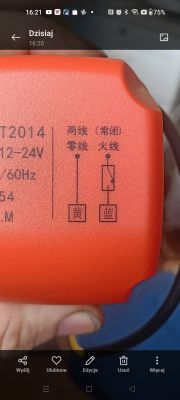 Close-up of an orange device housing with a printed wiring diagram and Chinese characters.