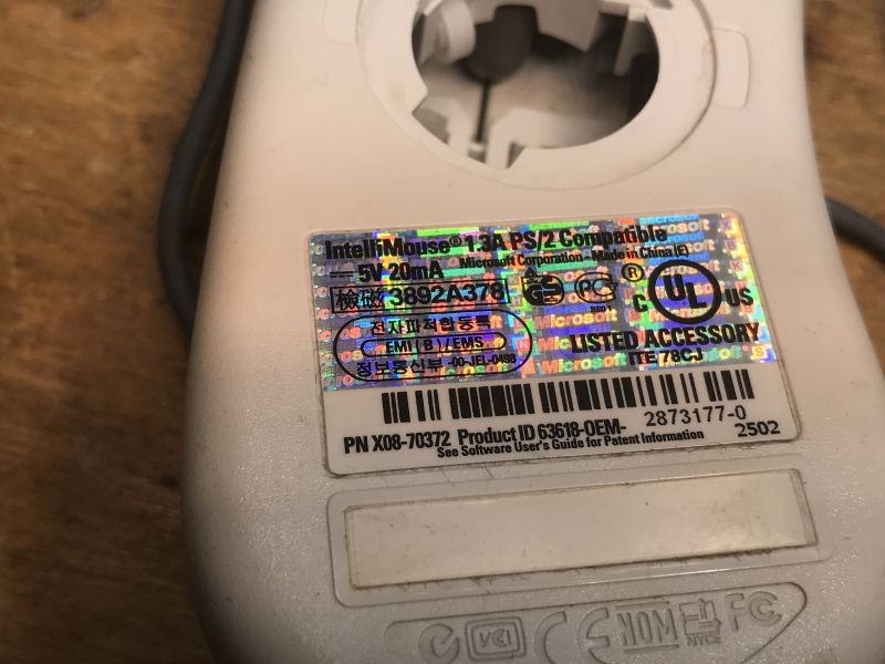 Microsoft IntelliMouse Identification Label Label on the bottom of an old Microsoft IntelliMouse.