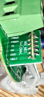 Close-up of a PCB with pin labels and a connector.