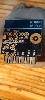 Printed circuit board with labels for various connections.