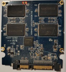 SSD PCB with Phison controller and marked pins for attempted Flash mode shorting