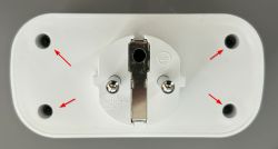 White Electrical Plug with Screw Markings Rear view of a white electrical plug with red arrows pointing to four screws.