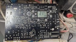 Image of an electronic circuit board with a display showing a temperature of 21°C.