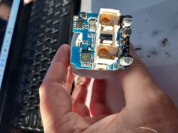 PCB with power and communication components Printed circuit board with electronic components held in a hand