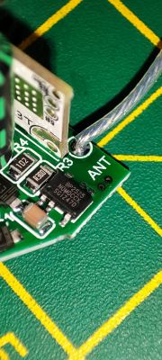 Close-up of a section of a PCB with visible electronic components.
