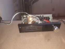 Prototype radio device with exposed electronics, display, and a large control knob
