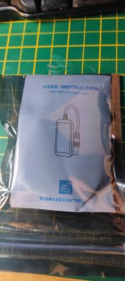 User instruction manual for Magic Home RGBW LED Controller in plastic packaging.