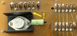 Close-up of circuit board with 2N1558 transistor and 22 ohm resistor, arrow shows repaired connection
