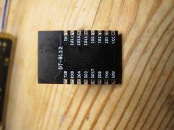 DT-BL12 Module on Wooden Background DT-BL12 module with short-range contacts on a wooden background.