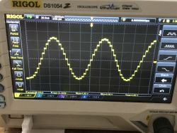 Sine Wave Signal Oscillogram from Arduino R4 Oscillogram displaying a sine wave signal generated by Arduino R4 on an oscilloscope screen.