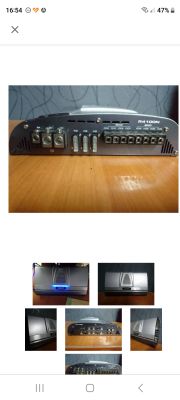 Wzmacniacz samochodowy z różnymi złączami na panelu.